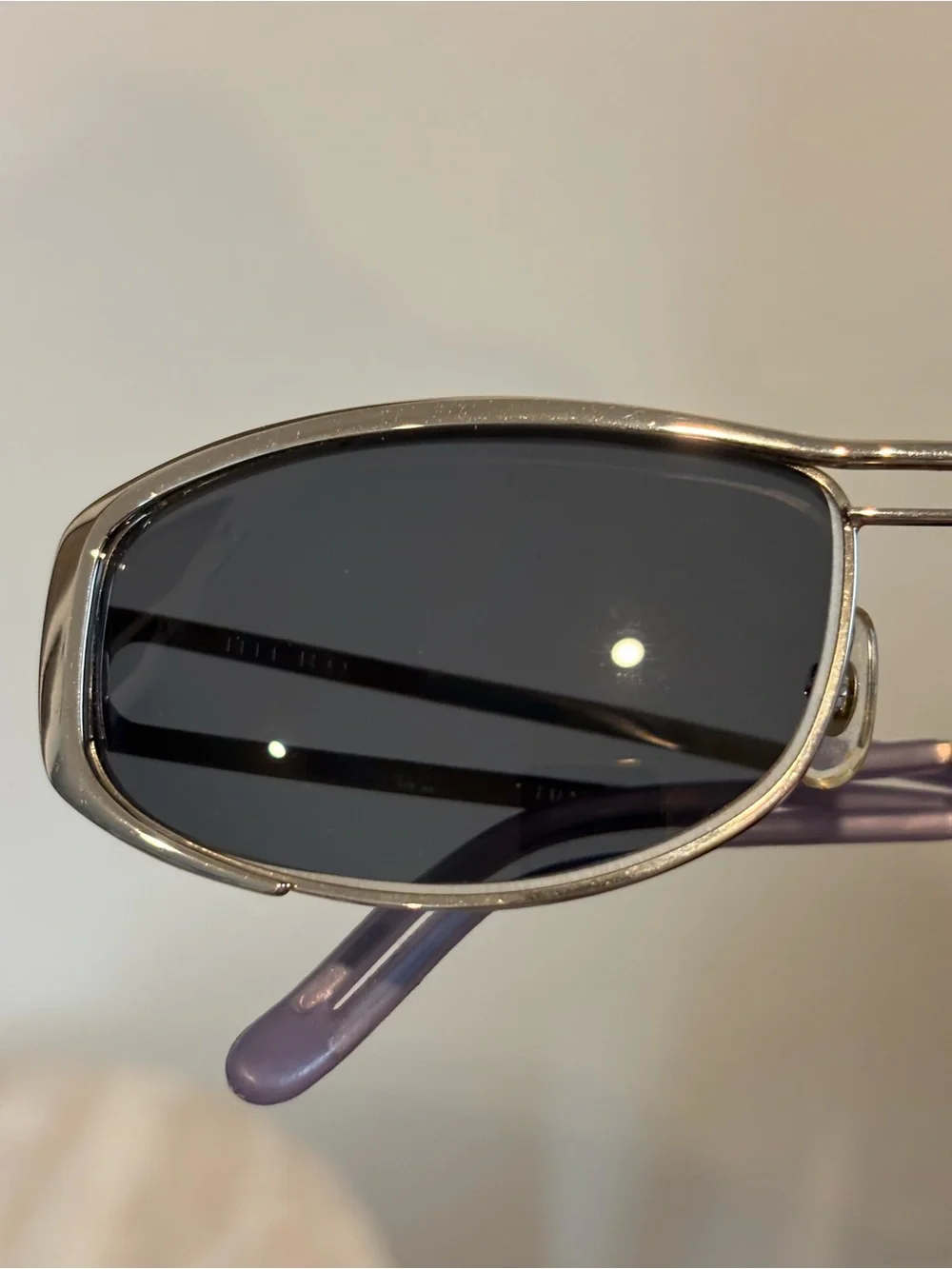 Hiero Elongated Oval Sleek Silver Frame Sunglasses with Dark Lenses